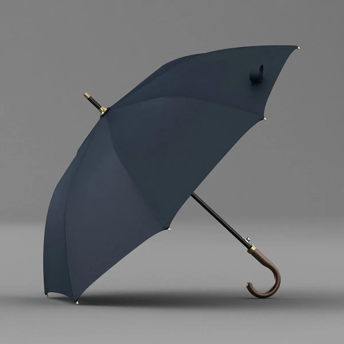 The luxury stick umbrella in navy blue, featuring a genuine brown leather crook handle, shown open.