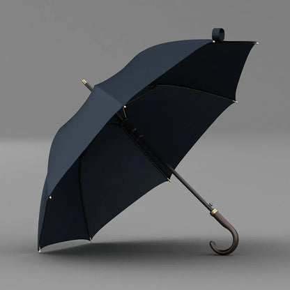 Angled view of the open navy blue canopy on the luxury leather handle umbrella.