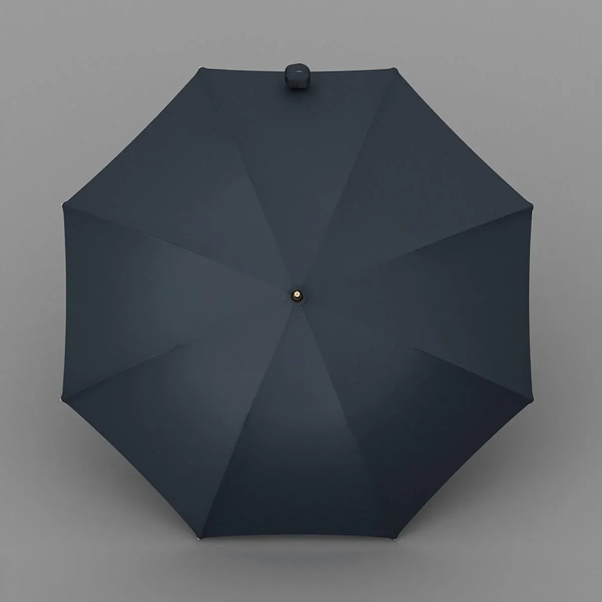 Top-down view of the open navy blue luxury umbrella showing the 8-rib canopy.