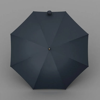 Top-down view of the open navy blue luxury umbrella showing the 8-rib canopy.