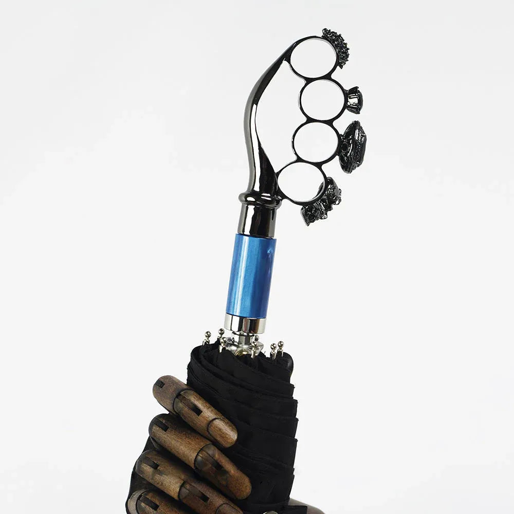 The luxury gothic folding umbrella featuring the iconic ring handle with a blue metallic accent.