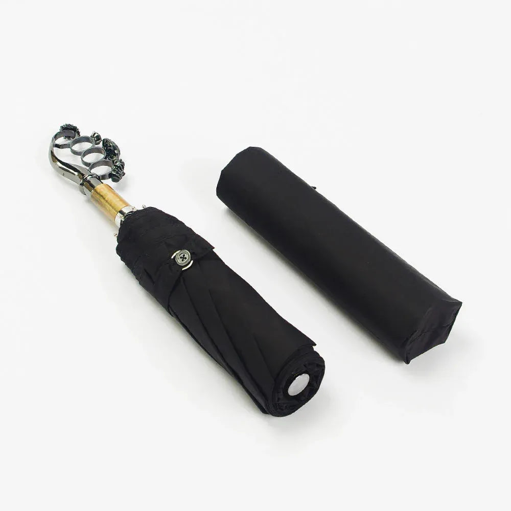 View of the closed luxury ring handle umbrella lying beside its protective sleeve.