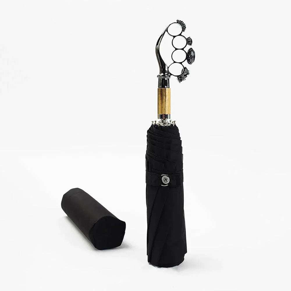 The closed luxury ring handle umbrella shown next to its black protective sleeve.