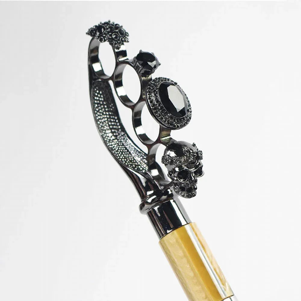 Detailed close-up of the gothic ring handle featuring skulls, gems, and intricate metalwork.