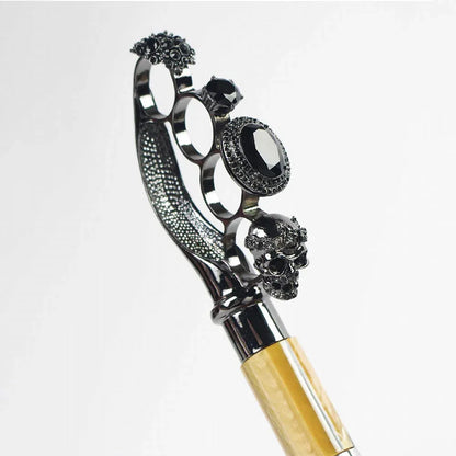 Detailed close-up of the gothic ring handle featuring skulls, gems, and intricate metalwork.