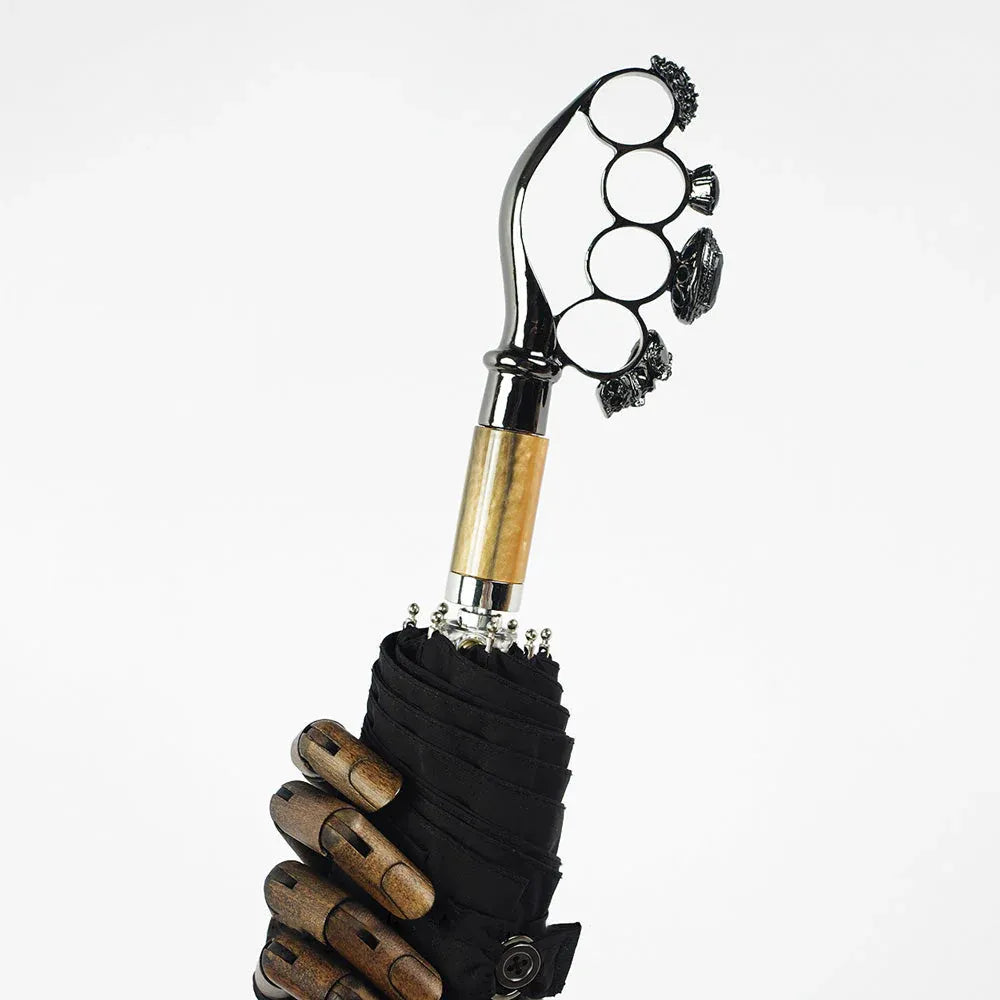 The luxury gothic folding umbrella featuring the iconic ring handle with a light wood accent.