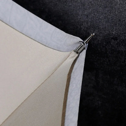 Detail shot from underneath showing the metal tip connection on the edge of the canopy.