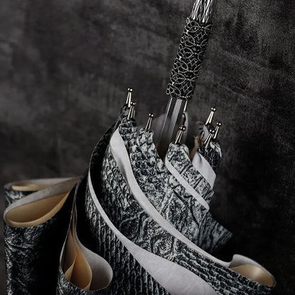 Close-up detail of the textured wrap around the shaft just below the silver snake handle.