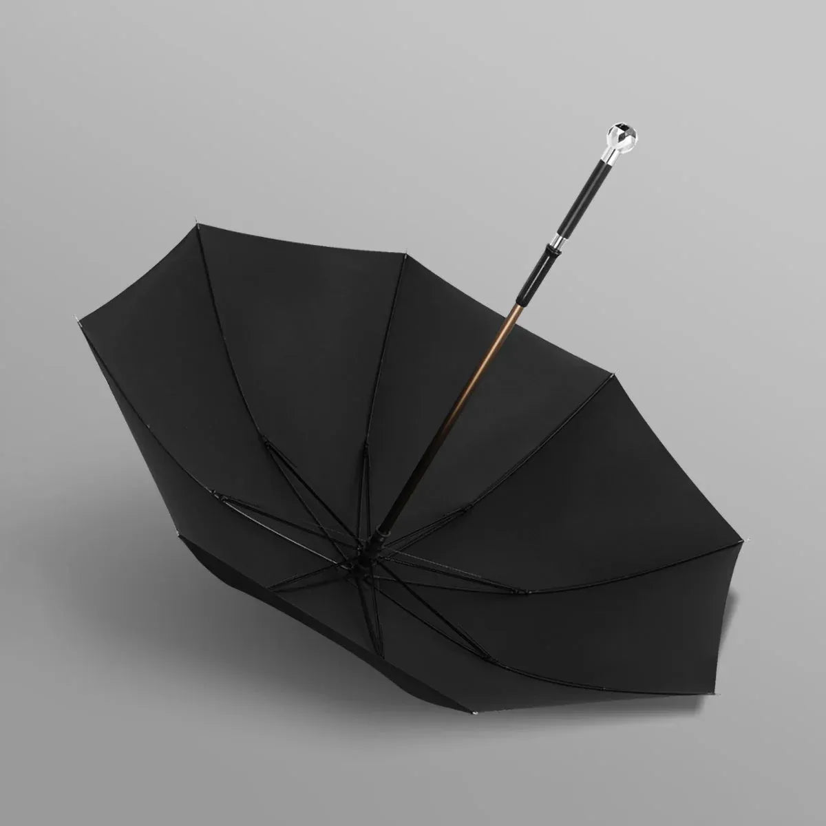 Full profile view of the open black canopy on the walking cane umbrella with the silver Diamond handle.