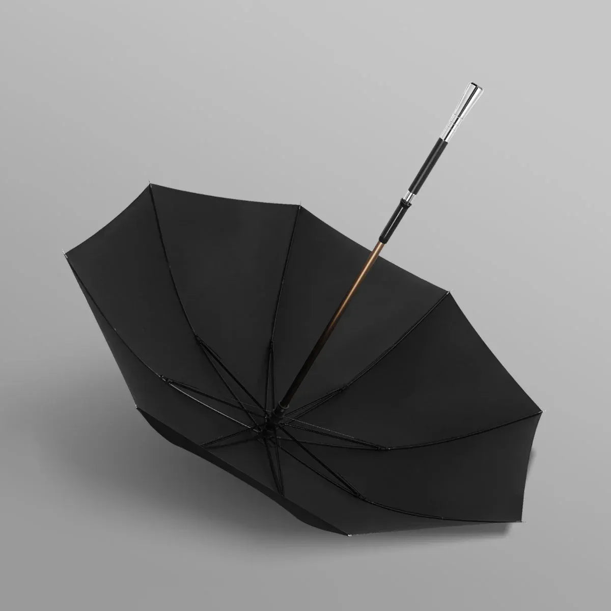 Full profile view of the open black canopy on the walking cane umbrella with the silver Pillar handle.
