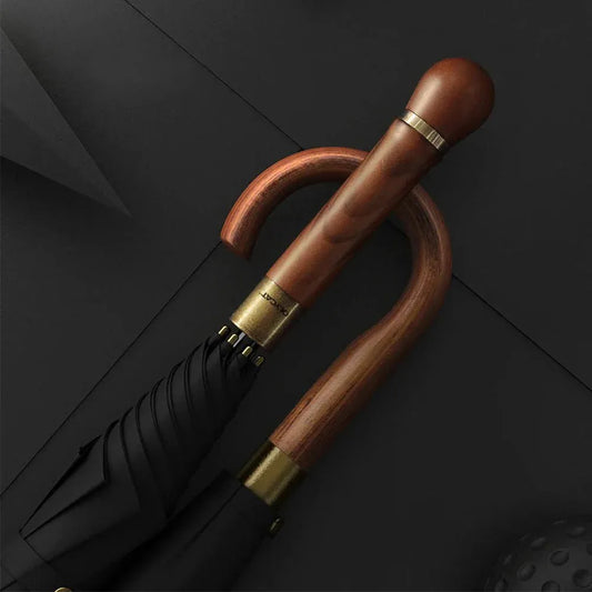 Close-up comparing the straight and crook style natural wood handles against a dark background.