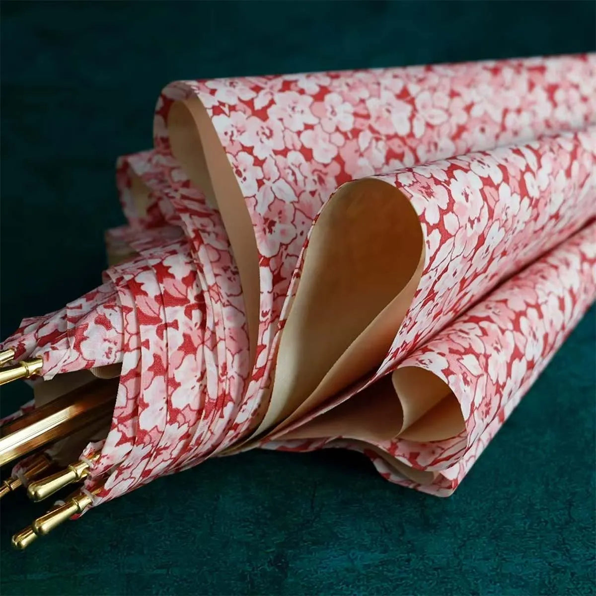 Close-up texture shot of the premium double-layer fabric with the pink floral pattern.