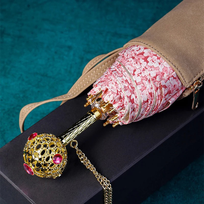 Pink floral umbrella with a luxury handle, perfect for ladies.