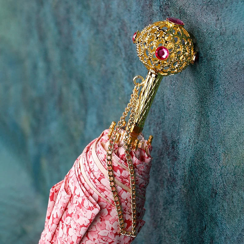 Side view of the pink floral umbrella showcasing its elegant design.