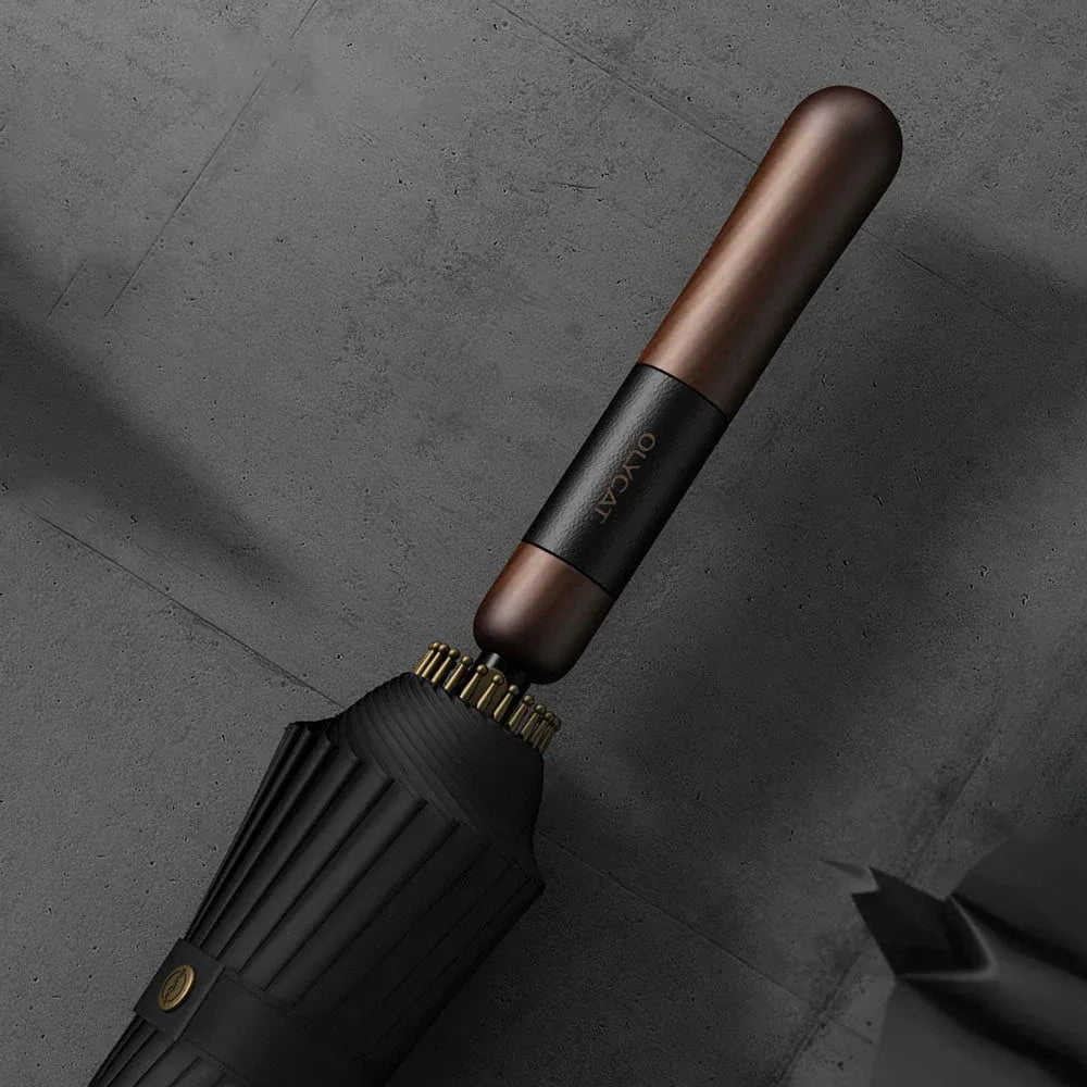 Detailed close-up of the straight wood handle with leather wrap detail and branding.