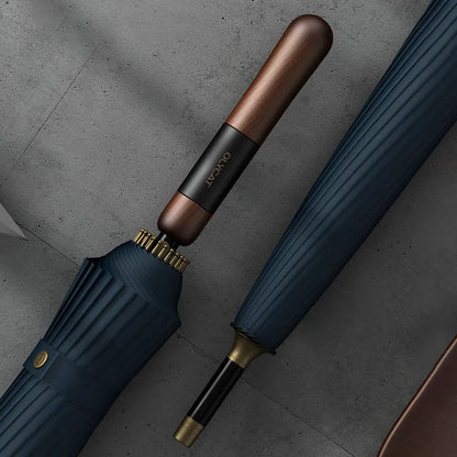 Close-up showing the detail of the wood handle with leather accent on the closed navy blue 24-rib umbrella.
