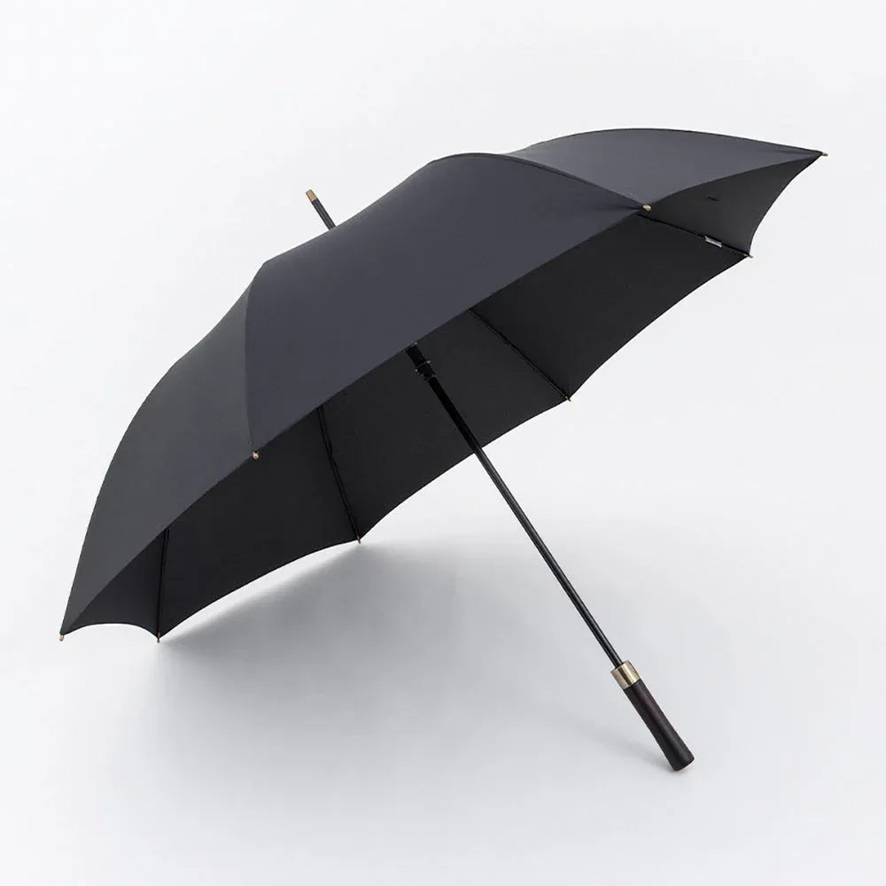 Profile view of the open large 52-inch premium rain umbrella in black with a straight wood handle.