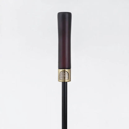 Detailed close-up of the elegant straight natural wood handle with metal accents.