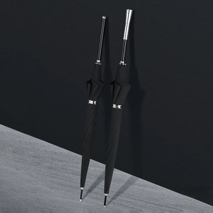 Two closed premium long handle umbrellas, one with an alloy handle and one with a dark wooden handle.