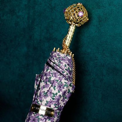 Side view of the Purple Flower Umbrella with a fancy crystal handle.