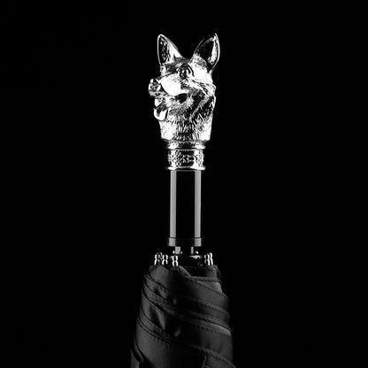 The silver animal head folding umbrella featuring the intricately detailed Dog handle against a black background.