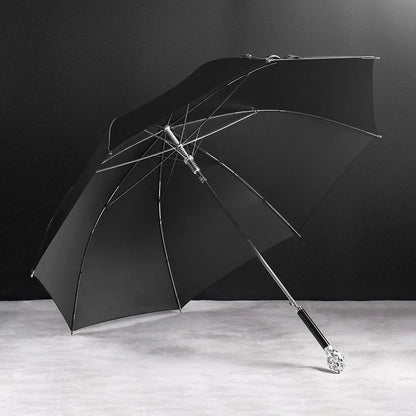 Angled view of the open Silver Lion Head umbrella resting on a surface.
