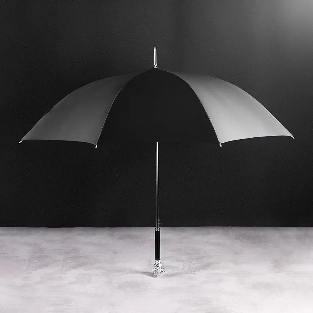 Full profile view of the open black canopy on the elegant Silver Lion Head umbrella.