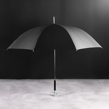 Full profile view of the open black canopy on the elegant Silver Lion Head umbrella.